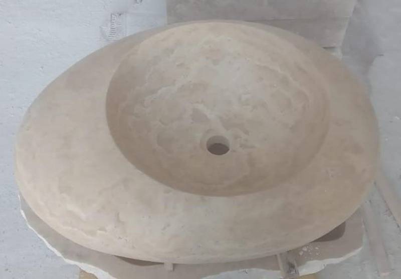 Vasque goutte d'eau en Travertin. Pierre Naturelle au showroom de Paris : 36 rue de Bourgogne 75007 PARIS (uniquement sur RDV)